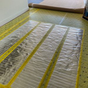 Comfort Heat Australia installation of under carpet foil mats.